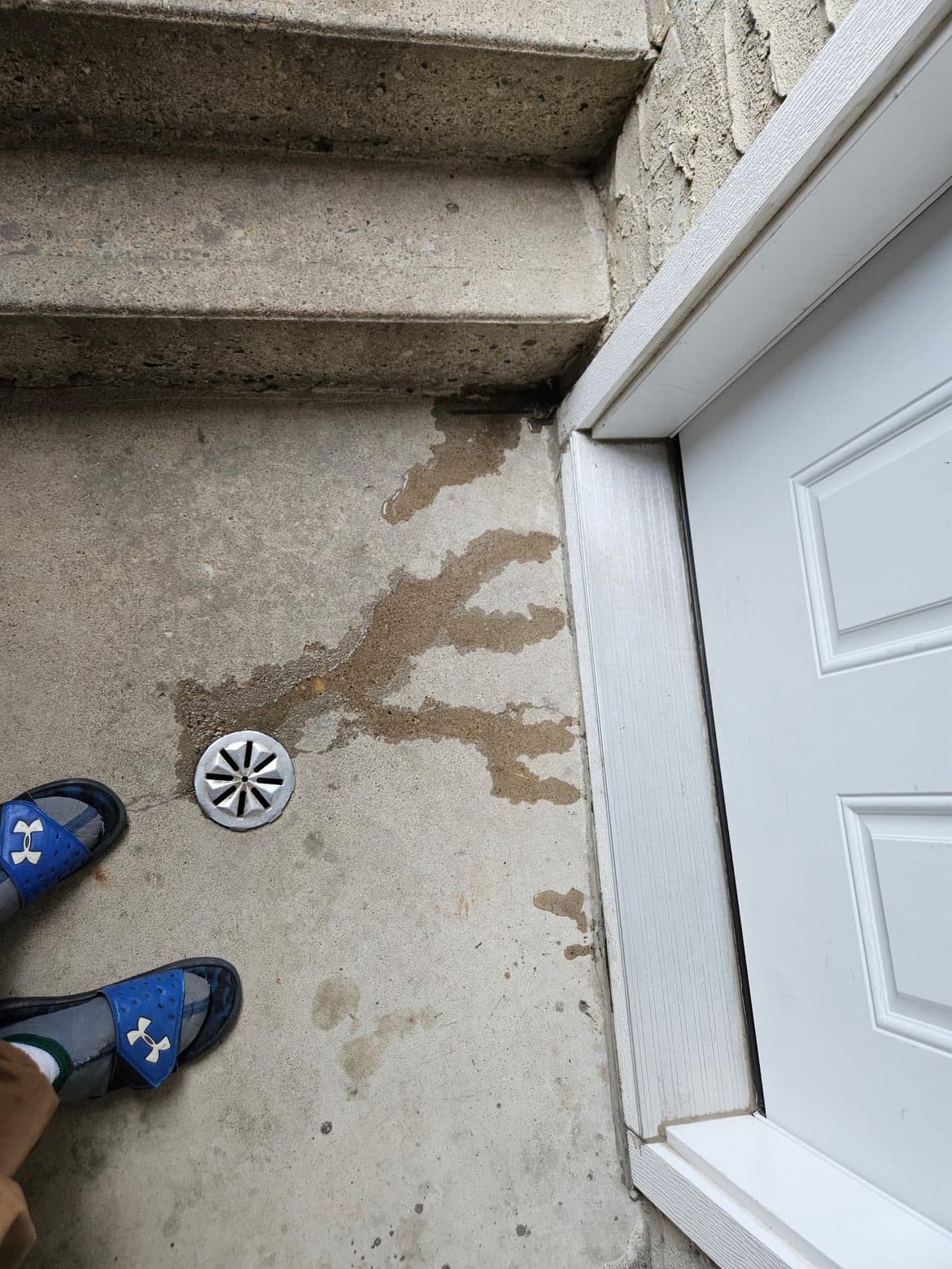 Storm flooding at property entry before restoration