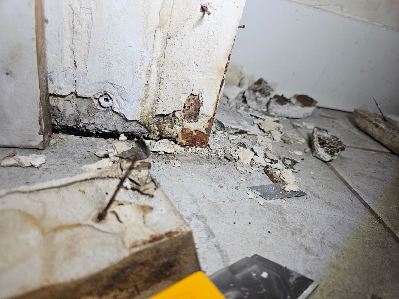 Structural decay at wall base before restoration